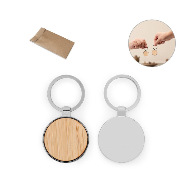 GASTON ROUND. Ronde sleutelhanger van ijzer, gemaakt van zink en bamboe